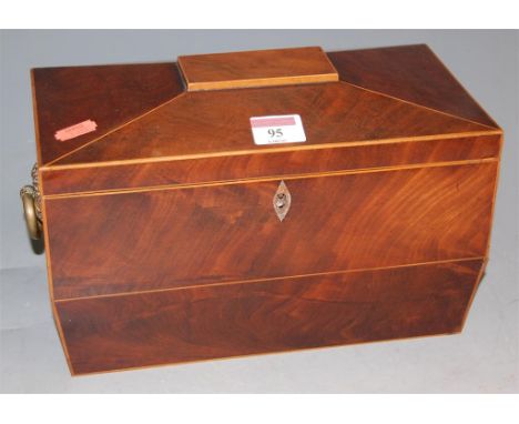 A 19th century mahogany and inlaid fitted tea caddy of sarcophagus form
