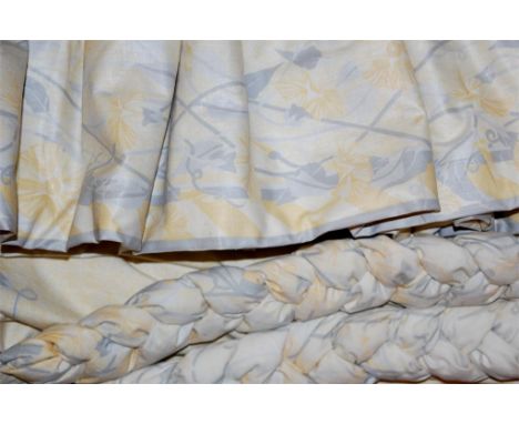 A pair of yellow floral lined curtains, approx 92 x 182cm, with matching pelmet and tie-backs