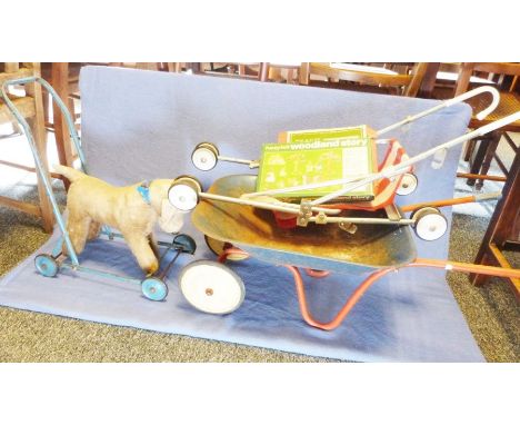 Child's vintage wheelbarrow, a child's vintage stuffed pushalong dog, a child's wooden jigsaw puzzle, a Victoria Austria part