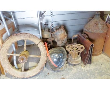 WWI metal helmet, a vintage manual crop spreader, a vintage wheelbarrow wheel, various vintage oil lamps, etc&nbsp;
