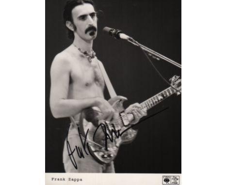 ZAPPA FRANK: (1940-1993) American Rock Composer & Guitarist. Signed 5 x 6.5 photograph of Zappa standing in a bare chested th