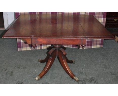 George III drop leaf sofa table in mahogany on quadrafoil base with original 'lion paw' castors. Fully opened it measures 44 