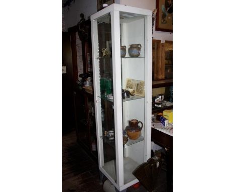 Modern aluminium framed display case with glass shelving and interior lighting 