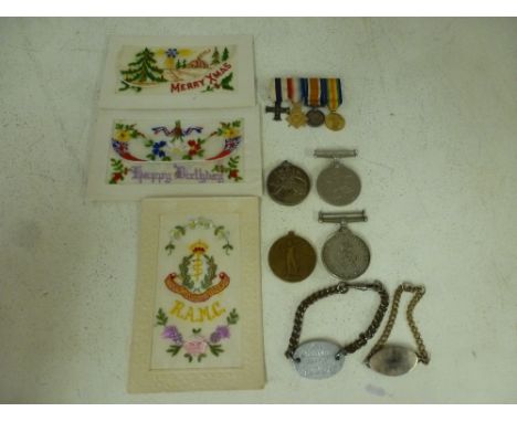 A miniature group of World War I medals including Military Cross, Mons Star, 1914-18  War medal and Victory medal, a World Wa