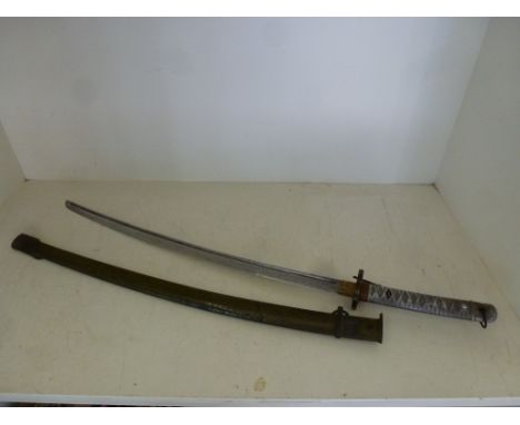 A Japanese NCO's World War II Army Samurai Kutana sword with aluminium grip and metal scabbard numbered 63777 to blade, blade