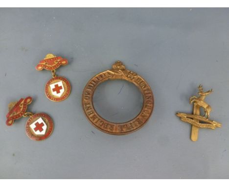 A Kimbolton Grammar School Combined Cadet Corps cap badge - slider struck J R Gaunt B'ham, two Huntingdon and Cambridge Red C