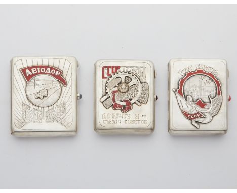 Group of three Soviet Russian silver and red enamel cigarette cases including:One case with the lid with an applied roundel d