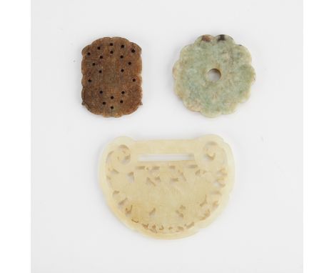 Three finely carved Chinese jade or jadeite pieces, including a jade lock with a lucky star, a money star, and a longevity st