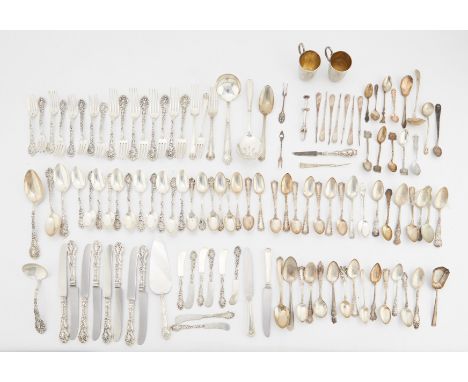 A large group of 122 pieces of American silver and sterling flatware. One sterling silver Gorham flatware set including: eigh
