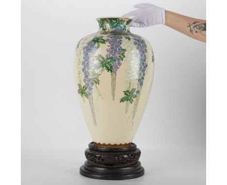 Massive Japanese satsuma vase, decorated with delicately cascading purple and white wisteria. Marked along the underside. Wit