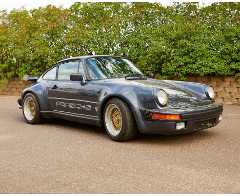 One Porsche 911 Turbo with a 930 body style in blue color with black leather interior. The car has a turbocharged 3.3-liter f