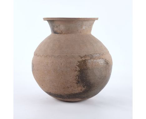 Chinese Han Dynasty ceramic pottery vase with an embossed pattern along the body. With a rounded form and flaring neck.Height