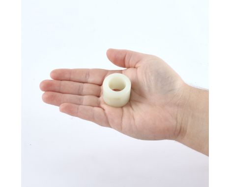 Chinese white jade archer's ring with pale russet inclusions. With a silk box.(Jade) Height: 1 in x diameter: 1 1/4 in; weigh