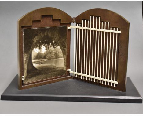 Irve Dell (20th/21st c) and Lynn Geesaman (b. 1938). Untitled metal sculpture with a photograph. Bronze form with leaves in l