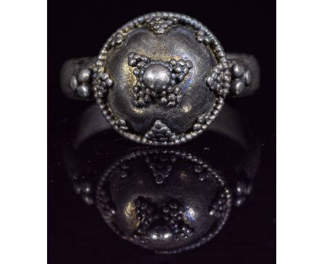 Ca.900- 1100 AD. Wearable Viking Silver ring with circular shaped bezel with intricate granulation decoration. Fine Condition