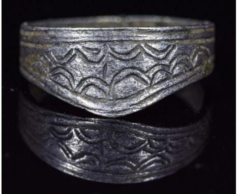 Ca.1200 AD. Wonderful wearable Medieval silver archers ring with geometric patterns depicted in front part of bezel, made to 