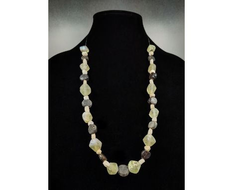 Ca.900 AD. Superb wearable Viking necklace, consisting by clear glass beads, black glass beads and ceramic beads. Good Condit