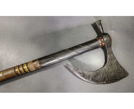Ca. 900 AD. An iron Viking Danish axe head with broad curved blade; including a hand-made, reconstructed wood and copper hand