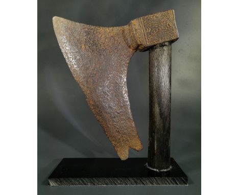 Ca.1200-1500 AD. A substantial battle iron axe-head with elaborately decorated rectangular-section socket, broad bearded blad