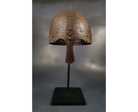 Ca. 800 - 1100 AD. Rare medieval four-plate iron helmet with nose guard intacted ; formed of triangular sections; attached wi