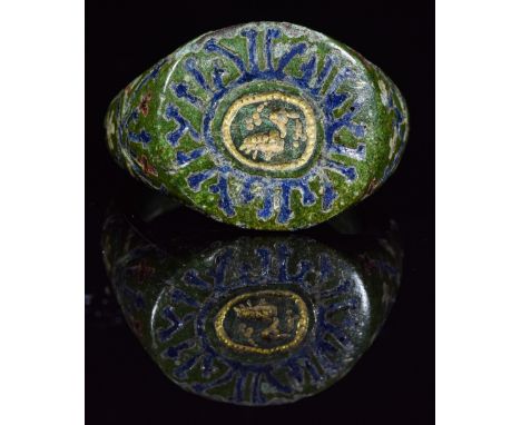 Ca.900 AD. Superb, wearable Viking ring with runic script inlayed wuth original blue glass enamel; central section depicting 