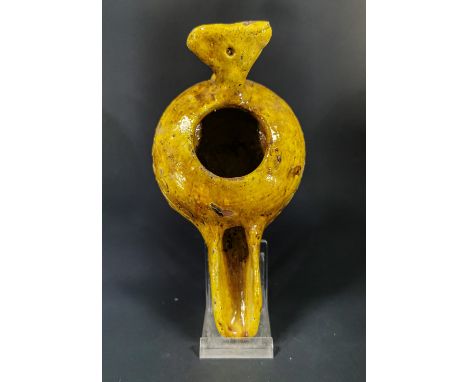 Ca.1000 AD Medieval Islamic terracotta glazed clay moulded oil lamp with geometric design relief and bright yellow glaze char