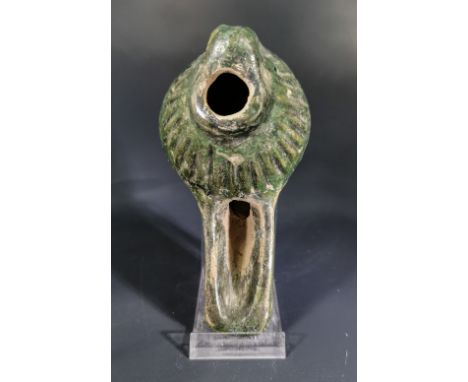 Ca.1000 AD Medieval Islamic terracotta glazed clay moulded oil lamp with geometric design relief and green glaze characterist