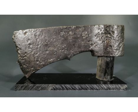 Ca.800 AD. A large, heavy, iron axe head, probably from a francisca, a specific type of throwing axe, with (as here) a distin