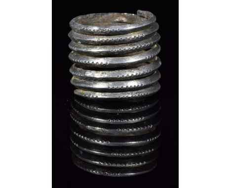 Ca.900- 1100 AD. A Beautiful Viking Scandinavian Silver coiled ring representing the norse myth of Jormungandr, the Midgard S