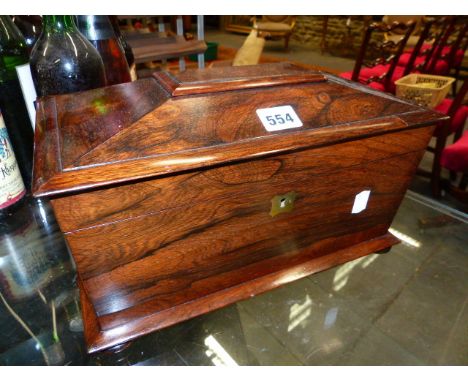 AN EARLY 19TH.C.ROSEWOOD TWO COMPARTMENT SARCOPHAGUS TEA CADDY WITH LATER GLASS MIXING BOWL.