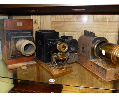 THREE PART MAGIC LANTERNS, AN EARLY PROJECTOR AND  VARIOUS BLACK AND WHITE SLIDES OR NEGATIVE PLATES.  (QTY)