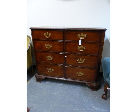 A BESPOKE CARVED MAHOGANY CHIPPENDALE STYLE CHEST WITH AN UNUSUAL ARRANGEMENT OF TWO BANKS OF FOUR GRADUATED DRAWERS.   W.130