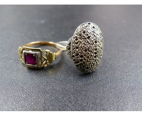AN ART DECO YELLOW METAL RUBY RING. WEIGHT 3GRMS TOGETHER WITH A WHITE METAL MARCASITE PAVE SET RING. 
