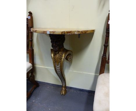 A CARVED PAINTED AND GILTWOOD DEM-ILUNE CONSOLE TABLE IN THE KENTIAN MANNER WITH FAUX MARBLE TOP ABOVE FIGURAL SUPPORT.   W.6