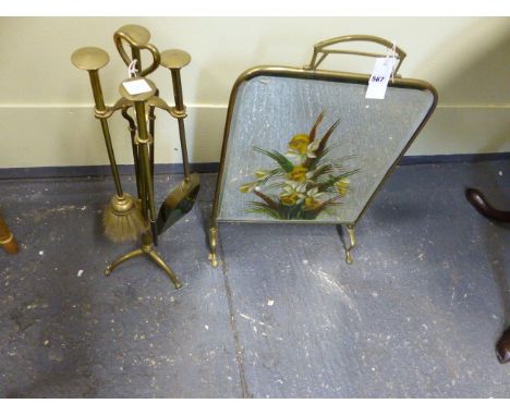 AN ARTS AND CRAFTS DESIGN BRASS FIRE TOOL SET WITH STAND TOGETHER WITH A DECORATED MIRRORED FIRE SCREEN.