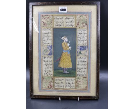 INDO PERSIAN SCHOOL.   PORTRAIT OF A PRINCE HOLDING A FLOWER, ILLUMINATED MANUSCRIPT LEAF.   35 X 24.5CMS.