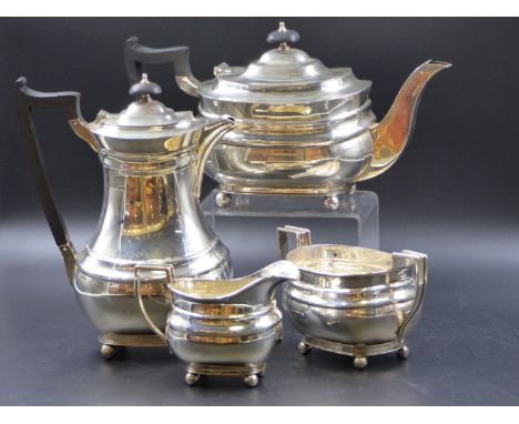 A SILVER HALLMARKED FOUR PIECE TEA SERVICE COMPRISING OF A TEAPOT, A HOT WATER POT, SUGAR BOWL AND CREAMER. DATED 1940-41 FOR