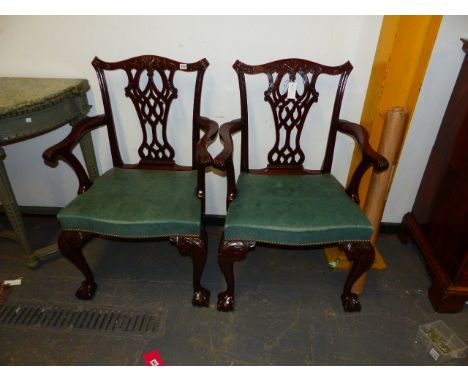 A PAIR OF CARVED MAHOGANY BESPOKE CHIPPENDALE STYLE ARMCHAIRS WITH PIERCED GOTHIC BACKSPLATS, SERPENTINE GREEN LEATHER SEATS 