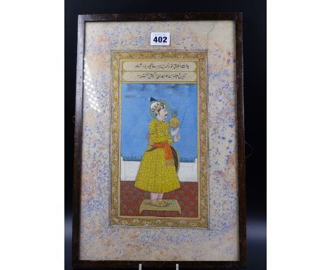 INDO PERSIAN SCHOOL.   PORTRAIT OF A STANDING COURTLY FIGURE HOLDING SYMBOLIC OBJECTS.   39 X 24.5CMS.