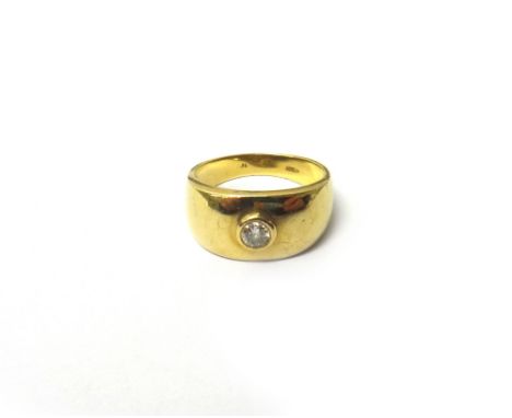 A gold and diamond set single stone ring, collet with a circular cut diamond, detailed 14, ring size P and a half.