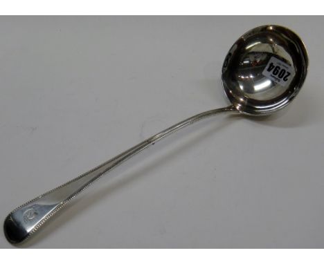 A George III silver bead edged Old English pattern soup ladle, crest engraved, London 1806, weight 200 gms.