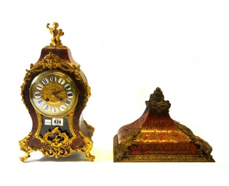 A French boulle bracket clock, 19th century, with cherub surmount over a dial set with enamel numerals, the shaped case with 