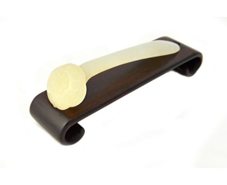 A Chinese white jade hairpin, late 19th/20th century, in the form of a ruyi sceptre, the head carved with a central foliate m