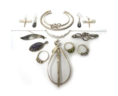 A collection of mostly silver jewellery, comprising; a Georg Jensen torque bangle, detailed 150 925 S Denmark, import mark Lo