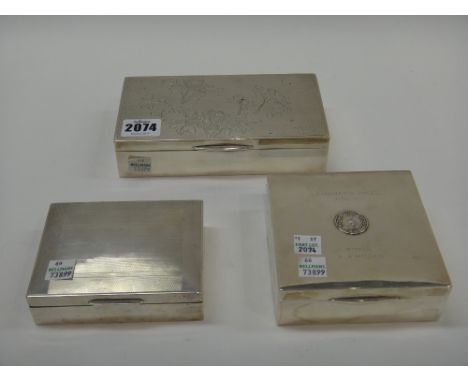 A group of three silver mounted cigarette boxes, each wooden lined within, one of square and two of rectangular form, one wit