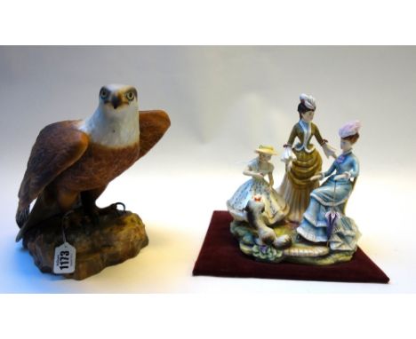 A Royal Crown Derby porcelain bald eagle on a naturalistic rocky base, 23cm high, and a Royal Worcester figure group 'The Tea