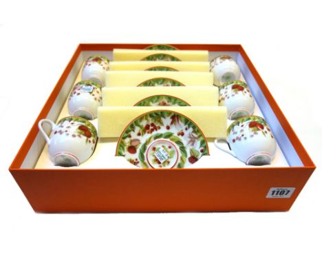 A Hermes part tea service decorated in the 'Le Jardin de Pythagore' pattern, comprising; six tea cups and saucers, a rectangu