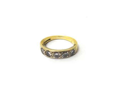 An 18ct gold and diamond five stone ring, mounted with a row of circular cut diamonds, ring size L and a half.