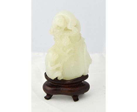 A Chinese white jade group of two monkeys, 20th century, carved clambering up a sack holding a flowering branch, 7cm. high, w
