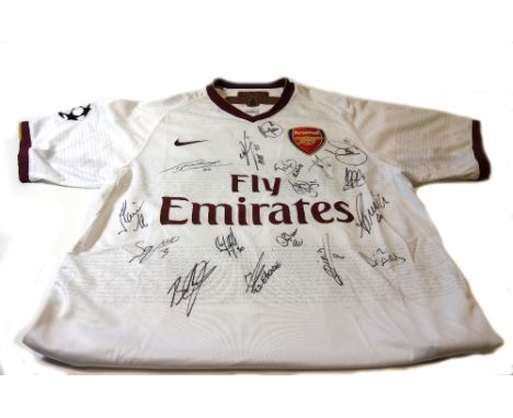 An Arsenal signed football shirt, 2013/14 season, boxed and with certificate, and another signed Arsenal shirt commemorating 